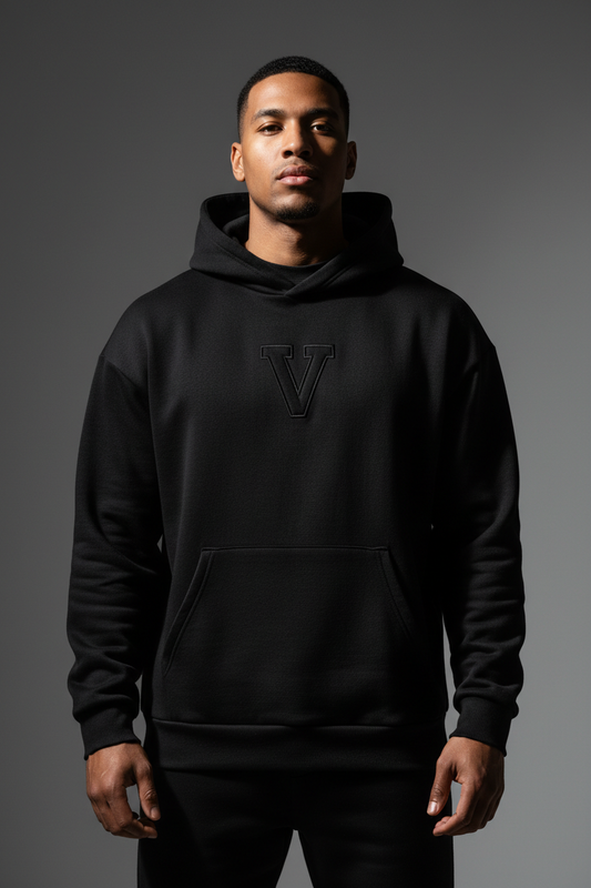 Vyral Premium Hoodie in Black - Front view with embroidered V emblem