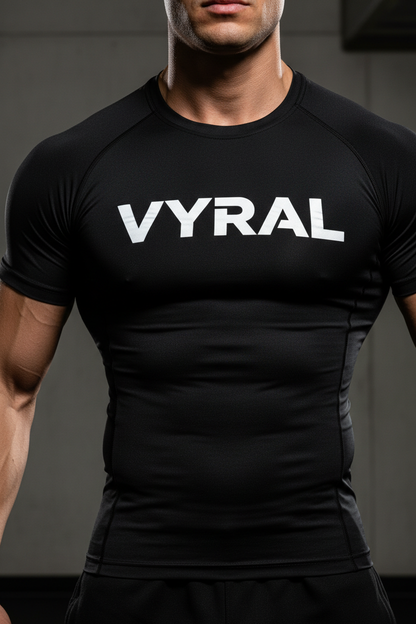 Vyral Compression Shirt in Black - Close-up showing muscle definition and bold VYRAL wordmark